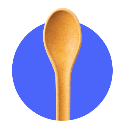 A photo of an edible spoon on a blue circle.